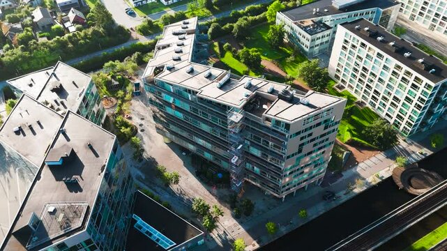 High angle aerial view of Orestad metro line and nearby buildings, Copenhagen
