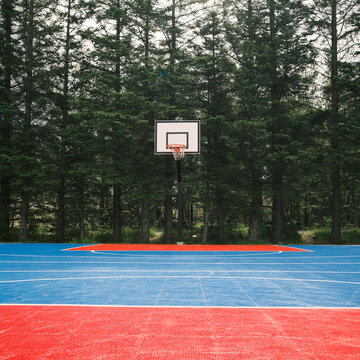 Empty basketball court with colorful flooring in nature