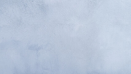 Blue plaster wall texture with a smooth surface, perfect for backgrounds or design projects.