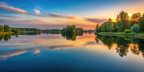 Obraz premium Evening calm tranquil reflections on a peaceful lake wallpaper