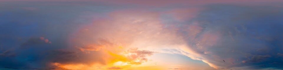 Sunset sky with bright glowing pink Cumulus clouds. Seamless spherical HDR 360 panorama. Full...