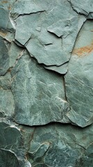 A close-up of textured green slate stone, showcasing unique patterns and geological details that enhance any design project.