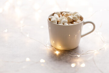 Cup of hot chocolate on white background