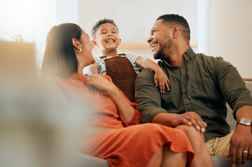 Laughing, smile and relax with family on sofa for love, comfortable and happiness together. Care,...