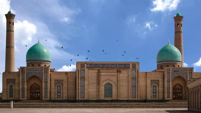 Hazrat Imam Mosque on Hazrat Imam Square. Khast Imam complex in Tashkent old town, Barak Khan madrasah - religious islam center Hast Imam Square.
Beautiful mosque with blue sky and birds Flying around
