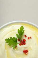 Mashed potatoes in bowl on gray background, close up