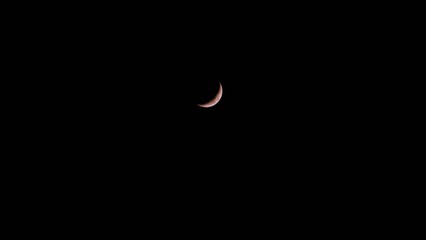 Crescent moon in night sky