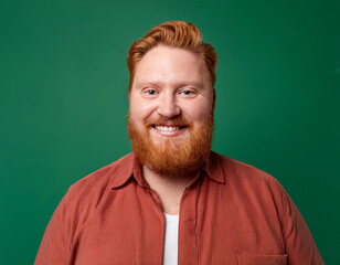Obraz premium Studio Portrait of Handsome Mature Man Happily Smiling Against Green Background