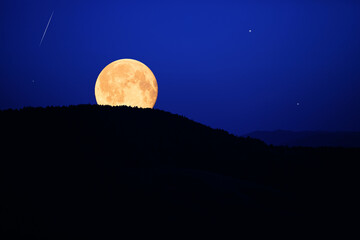 Full Moon, stars, planets and landscape scenery silhouettes.