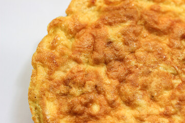 Simple egg omelette with herbs on white background