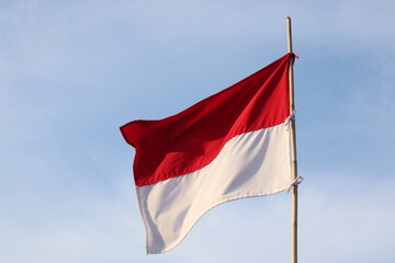 the Indonesian flag flying proudly in the sky