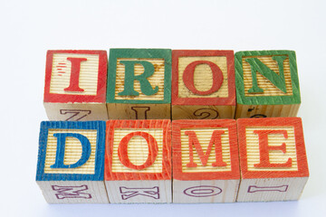 The term iron dome visually displayed on a clear background with copy space