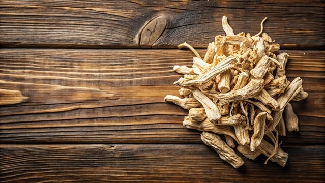 Dried marshmallow root on wooden background