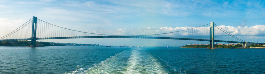Navigating under the Verrazzano-Narrows Bridge connecting the New York City boroughs of Staten Island and Brooklyn, NY, USA