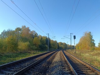 Two way railroad tracks in countryside. Two railway tracks. Sunny day. Countryside. Fields and...