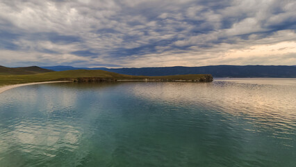 drone flight over the shore of Lake Baikal at sunset