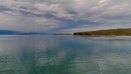 drone flight over the shore of Lake Baikal at sunset