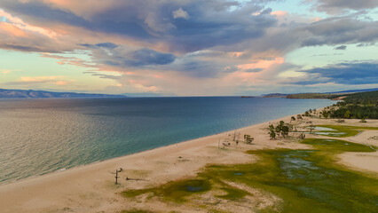 drone flight over the shore of Lake Baikal at sunset