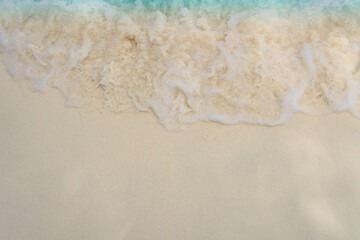 Wave on white sand beach 