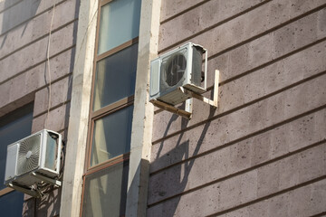 Conditioner mounted on the wall of the building.
