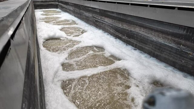 Large industrial bath for chemical treatment of metal products. Process in industrial factory