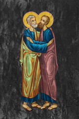 Fototapeta premium Traditional illustration of Saints Peter and Paul. Religious image on black stone wall background in Byzantine style