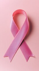 Pink breast cancer awareness ribbon on pink background,National cancer survivors month, Mother and World cancer day concept,Pink October Breast Cancer Awareness month.