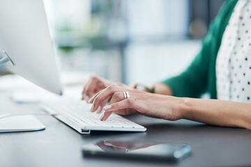 Hands, typing and keyboard with computer in office, planning and editing for project at media company. Person, writer and click with pc for report, review or proposal with feedback at creative agency