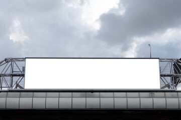 Horizontal blank billboard on metal truss structure on cloudy sky background. Mock-up.