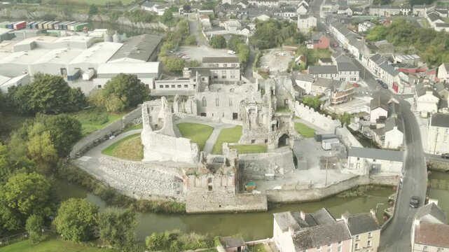 Desmond Castle Ruins Next To River Deel In Askeaton, Ireland, County Limerick. Aerial Drone Shot