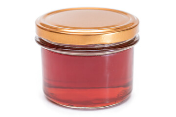 Dark Honey in a Small Glass Jar Isolated on White Background