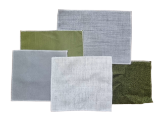 set of drapery curtain fabric samples in top view contains gret and green color isolated on background with clipping path. selected terry or canvas fabric type for furniture or blinds design.