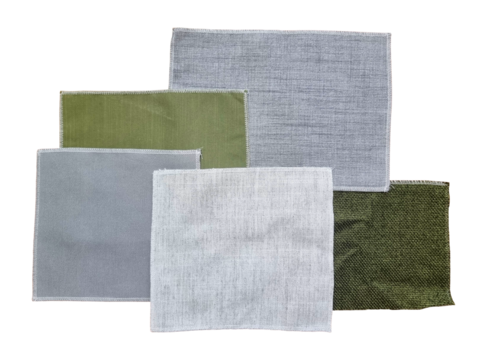 set of drapery curtain fabric samples in top view contains gret and green color isolated on background with clipping path. selected terry or canvas fabric type for furniture or blinds design.