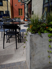 Street cafe in city with plants outdoor.