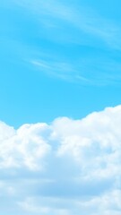Obraz premium Blue sky with soft white clouds, bright and serene atmosphere.