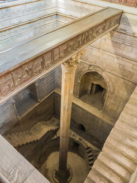 Nilometer, Islamic antiquities heritage, Nile water measurement device, control taxes on farmers, marble pillar column in the middle of stone building, selective focus, shallow depth of field, Cairo