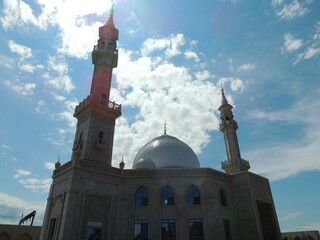 beautiful mosque in russia, islamic architecture, silhouette of muslim temple against blue sky with...