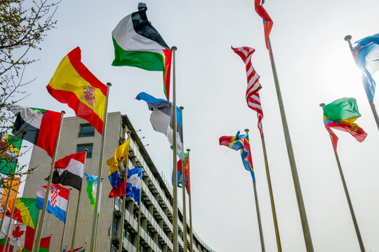 Flags and UNESCO (United Nations Educational Scientific and Cultural Organization) headquarters building  in Paris, France
