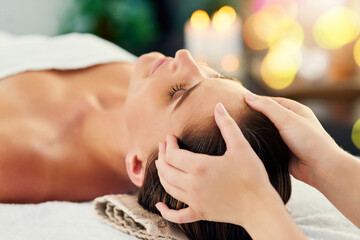 Hands, head massage and masseuse with woman in spa to relax as customer for hospitality or...
