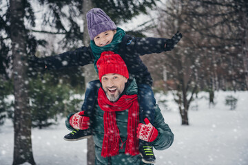 Photo of sweet funky daddy small kid wear windbreakers carrying shoulders having fun together outside urban city park