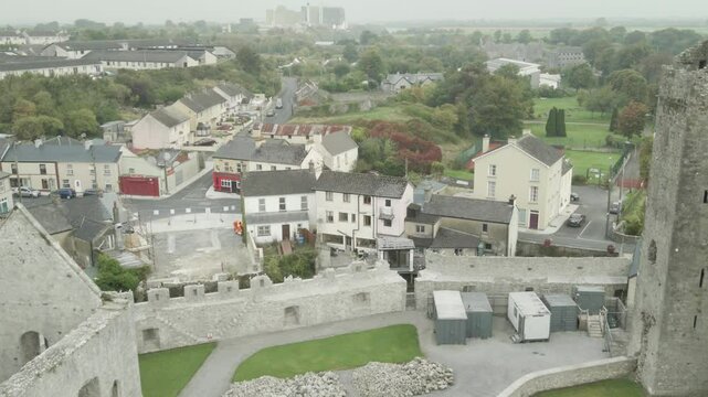 Desmond Castle With Gothic Banqueting Hall In Askeaton Ireland, County Limerick. Aerial Pullback Shot
