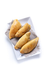 Pumpkin empanadillas for Halloween or Thanksgiving's Day isolated on white background. Top view. Copy space