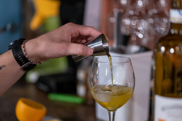 Man making a cocktail in a bar 