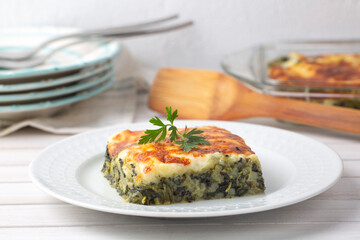 Baked Spinach with cheese delicious Italian food cuisine. Spinach gratin.