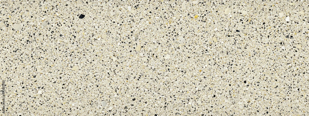 Poster a textured surface of light-colored aggregate with small dark particles, suitable for various applic