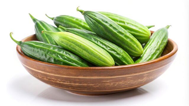 Green pointed gourd in a bowl isolated on white background
