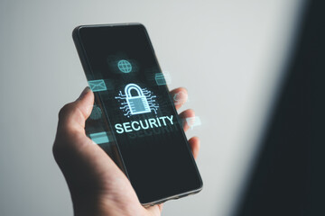 Business man using mobile phone with padlock and security icons screen, cybersecurity system concept, cloud computing, internet network communication