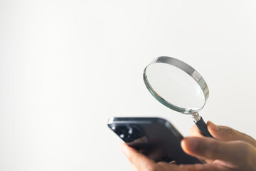 Business man searching information data on internet from his phone. Searching technology and data information concept.