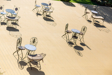 Empty Outdoor Café with Stylish Metal Chairs and Tables