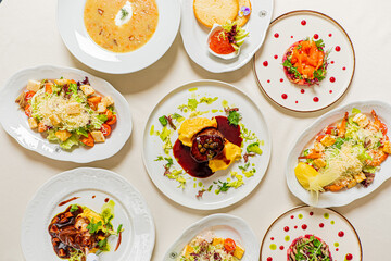 Christmas table with different dishes on table